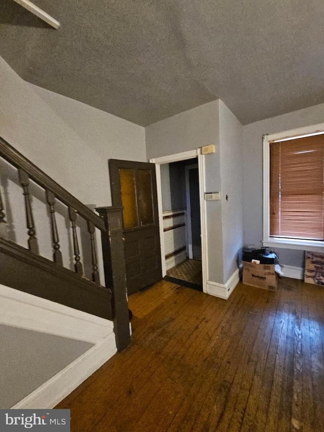 5541 Race St, Philadelphia, PA 19139 - interior space with wood-type flooring, a textured ceiling, and baseboards