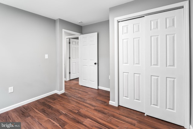 156 Dennis Ave, Browns Mills, NJ 08015 - unfurnished bedroom with dark wood-style floors, baseboards, and a closet