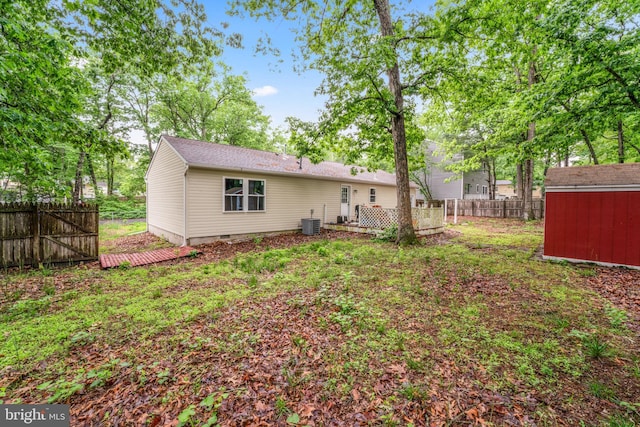 156 Dennis Ave, Browns Mills, NJ 08015 - back of property with a fenced backyard, central AC unit, and a deck