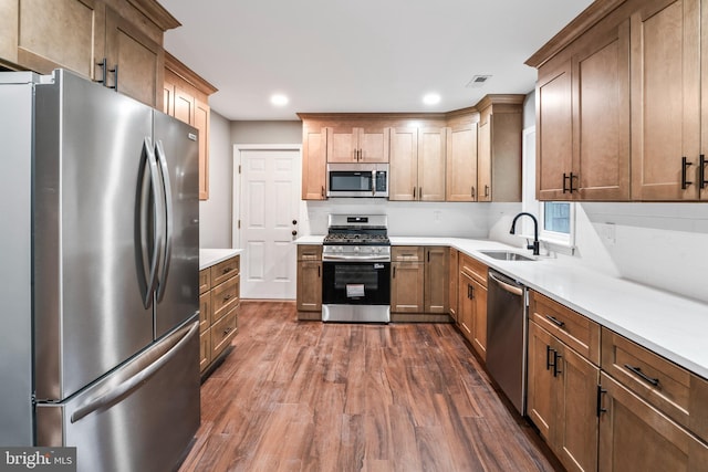 156 Dennis Ave, Browns Mills, NJ 08015 - kitchen featuring appliances with stainless steel finishes, a sink, dark wood-style flooring, light countertops, and recessed lighting
