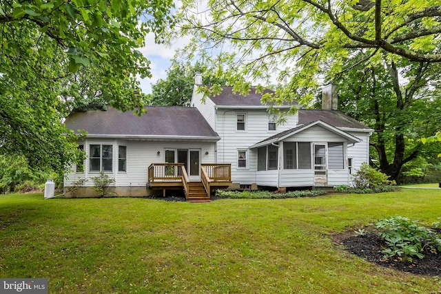 77 Alloway Friesburg Rd, Alloway, NJ 08001 - back of house with a sunroom, a chimney, a wooden deck, a lawn, and roof with shingles