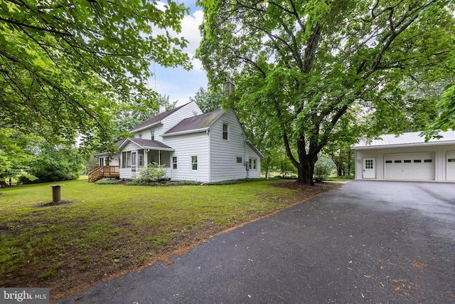 77 Alloway Friesburg Rd, Alloway, NJ 08001 - view of home's exterior featuring a garage, a lawn, a chimney, and asphalt driveway
