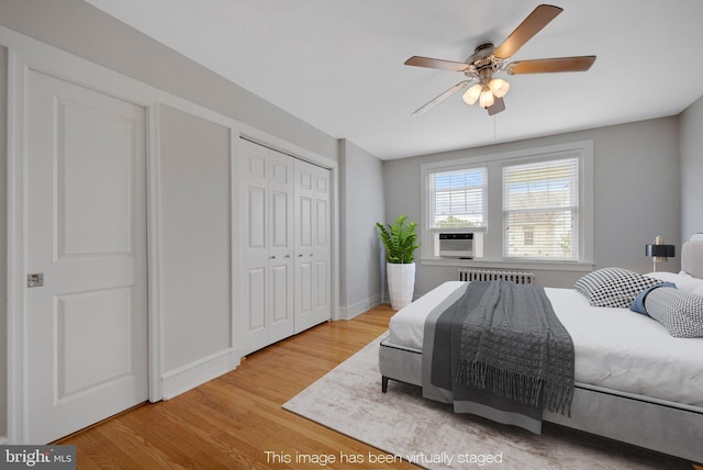 4441 Sherwood Rd, Philadelphia, PA 19131 - bedroom featuring radiator, wood finished floors, cooling unit, a closet, and ceiling fan