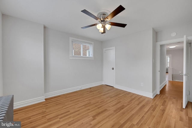 4441 Sherwood Rd, Philadelphia, PA 19131 - empty room with light wood finished floors, ceiling fan, baseboards, and a smoke detector