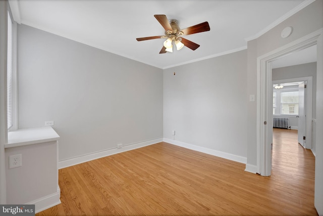 4441 Sherwood Rd, Philadelphia, PA 19131 - spare room featuring radiator, ceiling fan, light wood-type flooring, crown molding, and baseboards