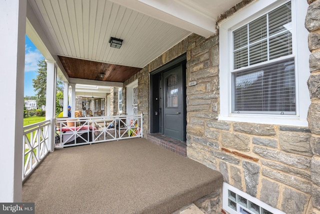 4441 Sherwood Rd, Philadelphia, PA 19131 - view of exterior entry featuring a porch and stone siding