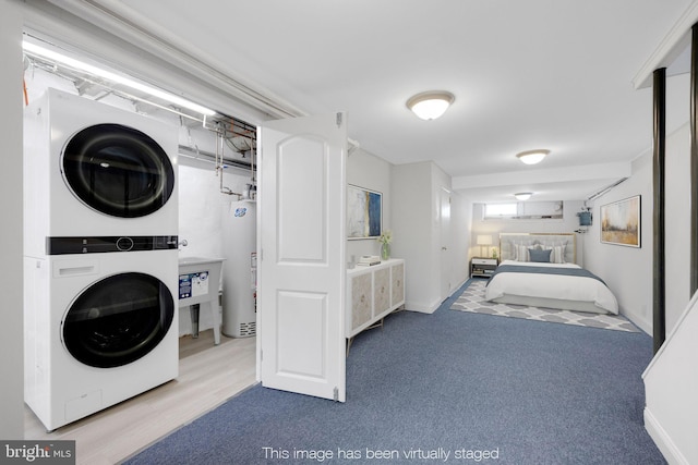 4441 Sherwood Rd, Philadelphia, PA 19131 - laundry area featuring stacked washer / drying machine and gas water heater