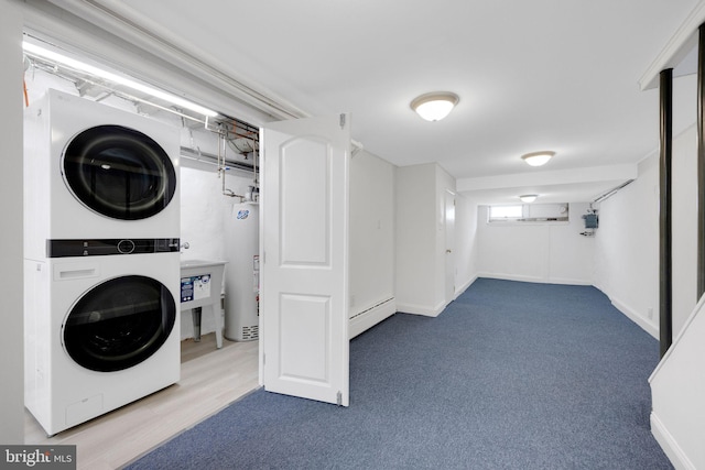 4441 Sherwood Rd, Philadelphia, PA 19131 - laundry room featuring stacked washing machine and dryer, baseboard heating, water heater, baseboards, and carpet floors