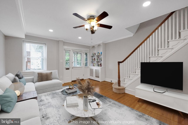 4441 Sherwood Rd, Philadelphia, PA 19131 - living room with wood finished floors, stairway, a ceiling fan, crown molding, and recessed lighting