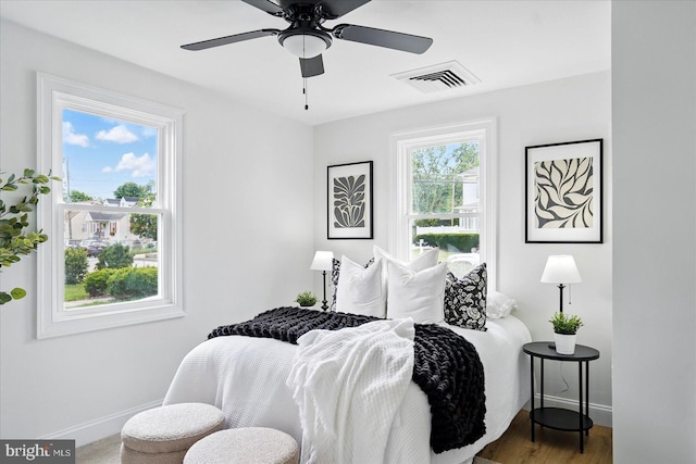 12 N Hawthorne Rd N, Middle River, MD 21220 - bedroom featuring baseboards, wood finished floors, and ceiling fan