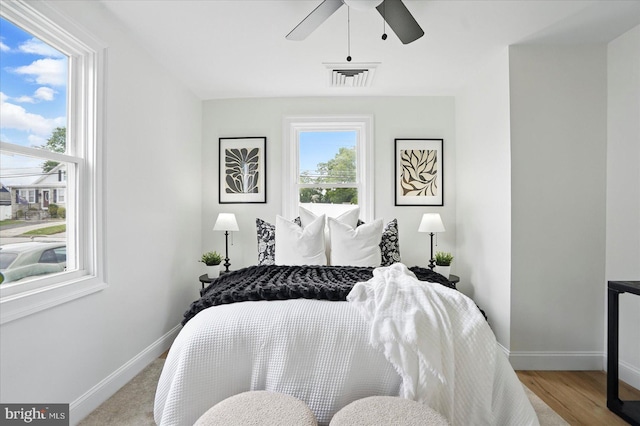 12 N Hawthorne Rd N, Middle River, MD 21220 - bedroom with baseboards, wood finished floors, and a ceiling fan