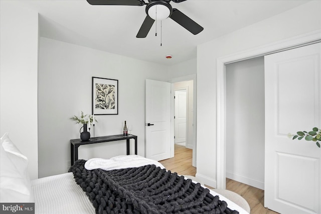 12 N Hawthorne Rd N, Middle River, MD 21220 - bedroom with light wood finished floors, baseboards, a ceiling fan, and a closet