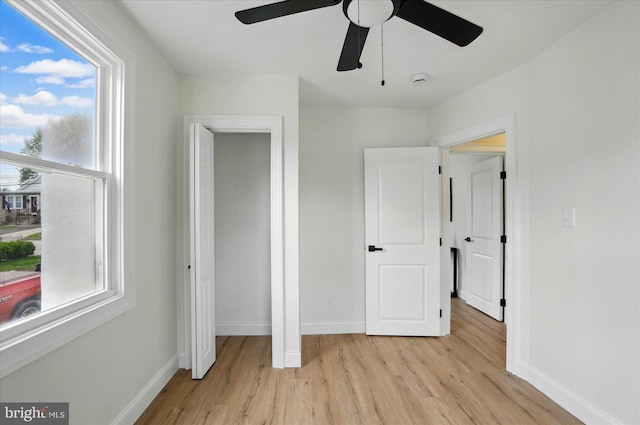 12 N Hawthorne Rd N, Middle River, MD 21220 - unfurnished bedroom with light wood finished floors, baseboards, and ceiling fan