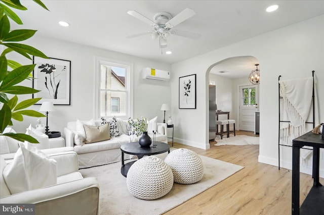 12 N Hawthorne Rd N, Middle River, MD 21220 - living area with arched walkways, a wall mounted AC, wood finished floors, ceiling fan, and recessed lighting