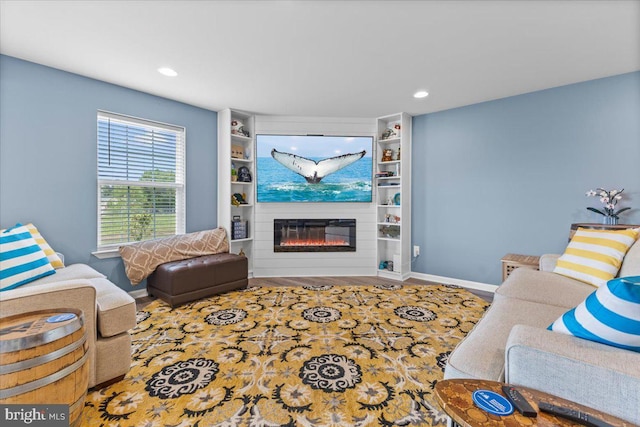 8051 Keystone Dr, Breinigsville, PA 18031 - living room featuring a glass covered fireplace, wood finished floors, recessed lighting, and baseboards
