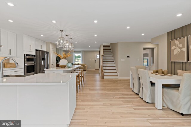 TBB Fontana Circle Whitehall Ii, Martinsburg, WV 25403 - dining area featuring stairs, light wood-style flooring, recessed lighting, a chandelier, and baseboards