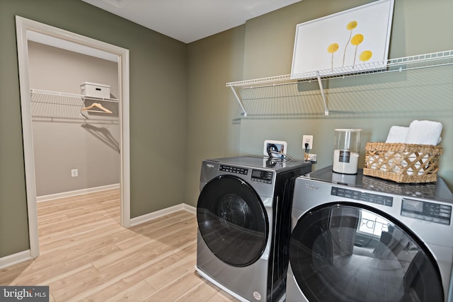 TBB Fontana Circle Whitehall Ii, Martinsburg, WV 25403 - laundry area featuring washing machine and dryer, light wood-style floors, and baseboards