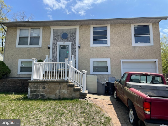 175 Village Dr, Barnegat, NJ 08005 - raised ranch with stucco siding and an attached garage