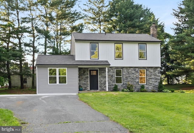 3017 Andover Rd, Forest Hill, MD 21050 - view of front of house featuring stone siding, a chimney, and a front yard