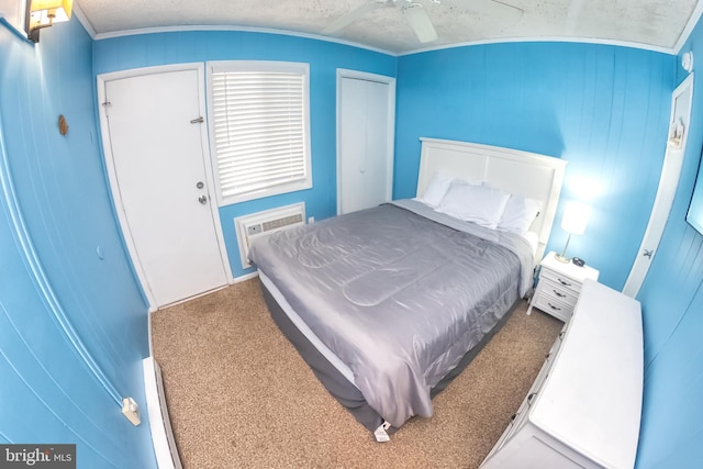 17 139th St Unit 105, Ocean City, MD 21842 - bedroom featuring carpet floors, a wall mounted air conditioner, and a ceiling fan