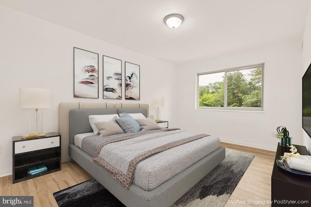 7056 Eastern NW Unit 308, Washington, DC 20012 - bedroom featuring light wood-style flooring and baseboards