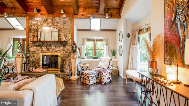 11500 Golden Post Ln, Gaithersburg, MD 20878 - living area featuring wood ceiling with exposed beams, healthy amount of natural light, wood finished floors, and a stone fireplace