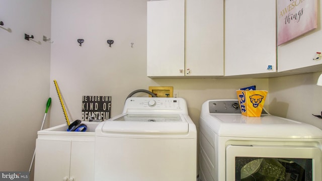 11500 Golden Post Ln, Gaithersburg, MD 20878 - laundry area featuring separate washer and dryer and cabinet space