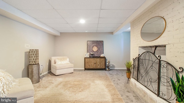 11500 Golden Post Ln, Gaithersburg, MD 20878 - living area featuring carpet flooring, a paneled ceiling, baseboards, and a fireplace