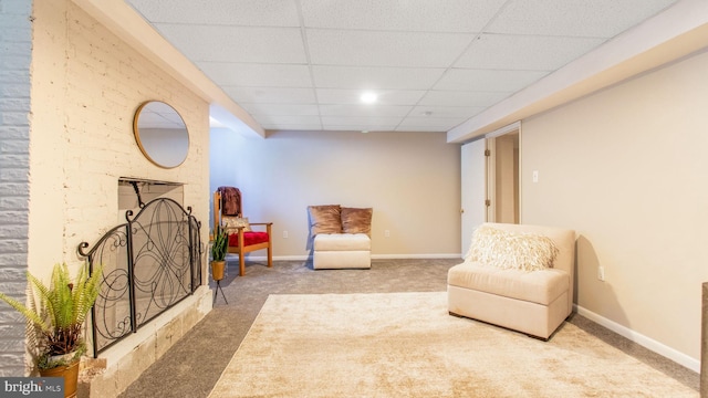 11500 Golden Post Ln, Gaithersburg, MD 20878 - living area with carpet flooring, a paneled ceiling, a fireplace with raised hearth, and baseboards