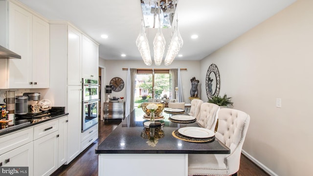11500 Golden Post Ln, Gaithersburg, MD 20878 - dining room featuring dark wood finished floors, a chandelier, and recessed lighting