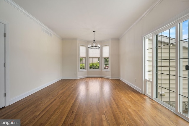 20 Doe Hill Ct, Camden Wyoming, DE 19934 - empty room with a chandelier, wood finished floors, baseboards, and crown molding