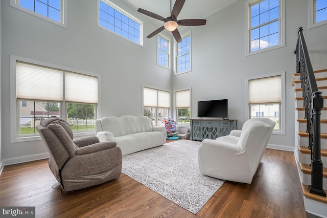 20 Doe Hill Ct, Camden Wyoming, DE 19934 - living area with a high ceiling, stairway, a ceiling fan, and healthy amount of natural light