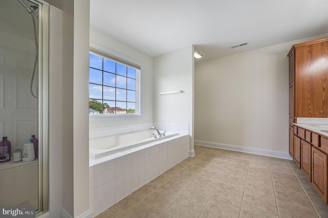 20 Doe Hill Ct, Camden Wyoming, DE 19934 - bathroom featuring a garden tub, vanity, a shower with shower door, tile patterned floors, and baseboards
