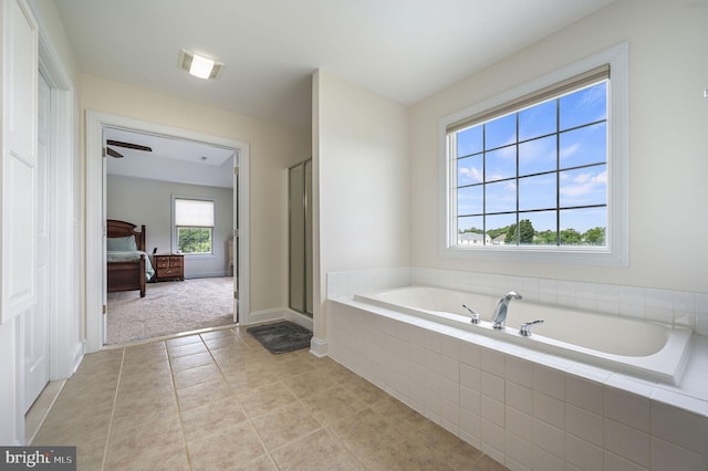 20 Doe Hill Ct, Camden Wyoming, DE 19934 - bathroom with ensuite bathroom, a garden tub, a shower stall, tile patterned floors, and baseboards