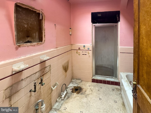 2244 E Washington Ln, Philadelphia, PA 19138 - full bath featuring a shower stall, a garden tub, wainscoting, tile walls, and tile patterned floors