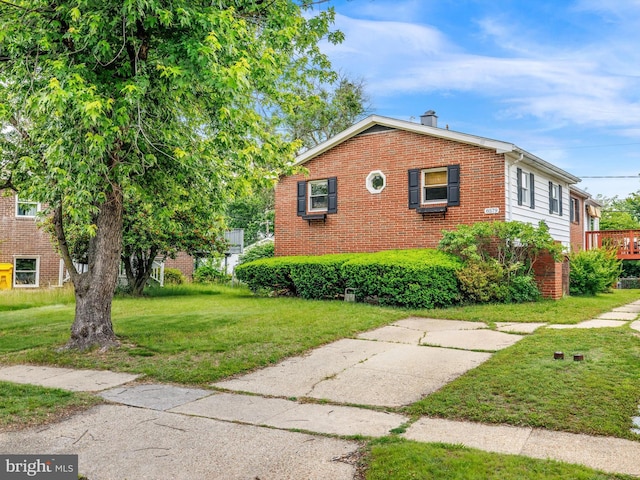 8579 Main Ave, Pasadena, MD 21122 - view of home's exterior with brick siding and a lawn