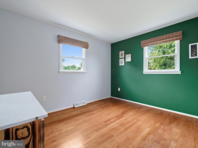 8579 Main Ave, Pasadena, MD 21122 - empty room featuring light wood-style flooring and baseboards