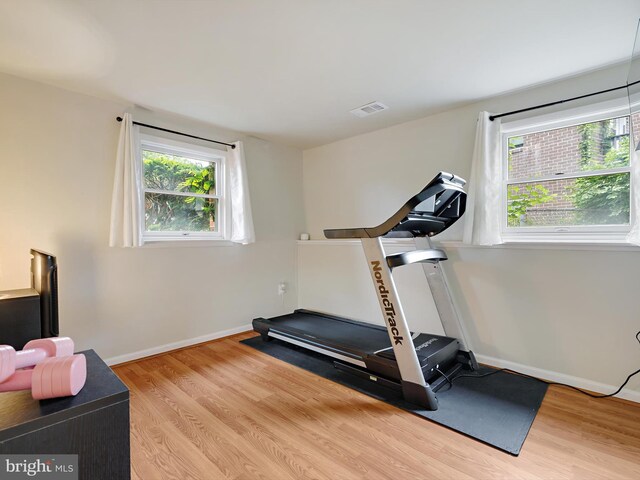8579 Main Ave, Pasadena, MD 21122 - exercise area with wood finished floors and baseboards