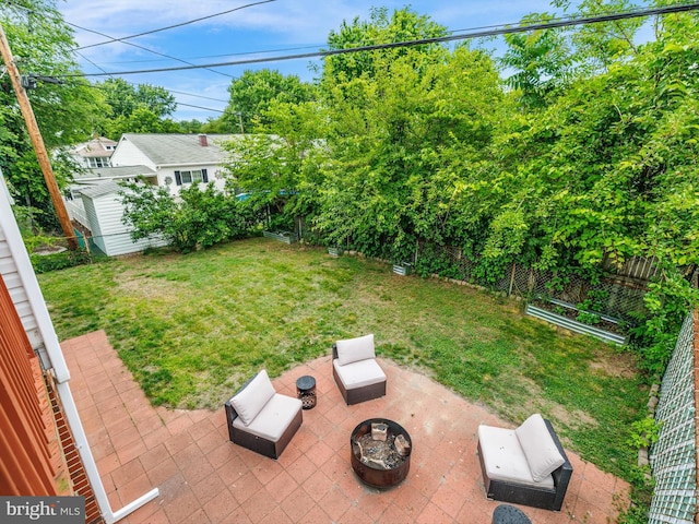 8579 Main Ave, Pasadena, MD 21122 - view of yard featuring a patio and an outdoor fire pit