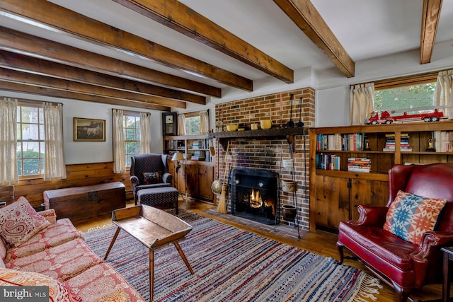 528 E Center Ave, Newtown, PA 18940 - living room featuring a fireplace, wainscoting, wood finished floors, wood walls, and beam ceiling
