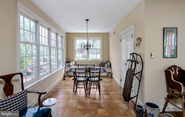 528 E Center Ave, Newtown, PA 18940 - dining room with baseboards, light tile patterned floors, and a chandelier