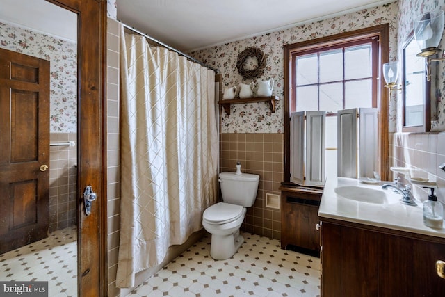 528 E Center Ave, Newtown, PA 18940 - bathroom with tile walls, wallpapered walls, vanity, toilet, and a wainscoted wall