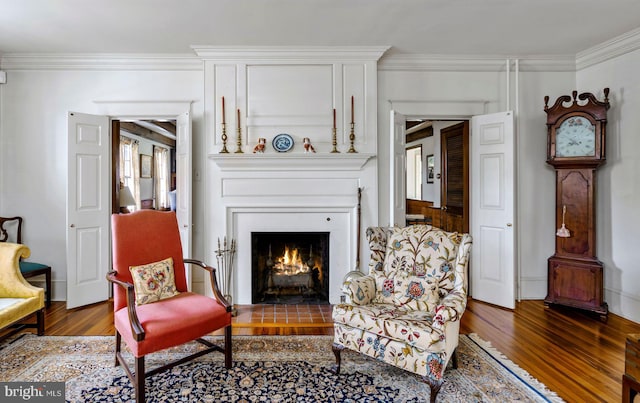 528 E Center Ave, Newtown, PA 18940 - sitting room with wood finished floors, a fireplace with flush hearth, and ornamental molding