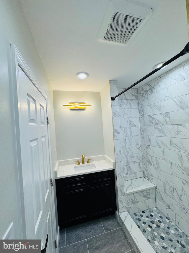 1402 W Saratoga St, Baltimore, MD 21223 - full bath with vanity, tiled shower, and tile patterned flooring