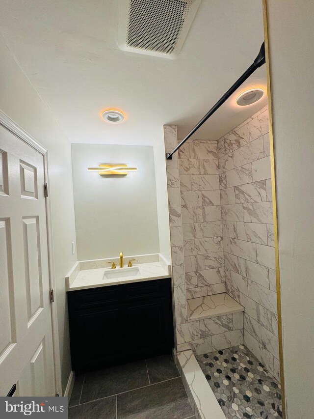 1402 W Saratoga St, Baltimore, MD 21223 - bathroom featuring vanity and a tile shower