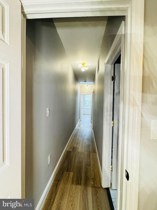 1402 W Saratoga St, Baltimore, MD 21223 - corridor featuring wood finished floors and baseboards