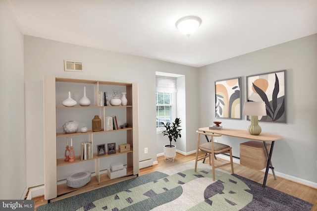 8007 Lewinsville Rd, Mclean, VA 22102 - office space featuring wood finished floors, a baseboard heating unit, and baseboards