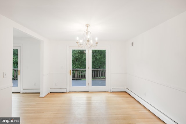 8007 Lewinsville Rd, Mclean, VA 22102 - unfurnished dining area with a baseboard radiator, plenty of natural light, a chandelier, and light wood-style floors