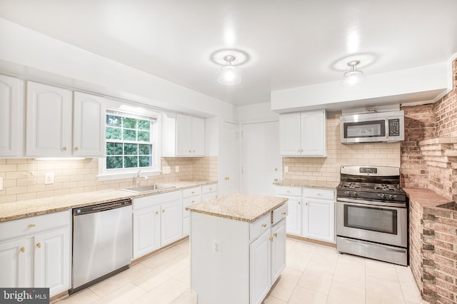 8007 Lewinsville Rd, Mclean, VA 22102 - kitchen featuring stainless steel appliances, a sink, light tile patterned floors, and tasteful backsplash
