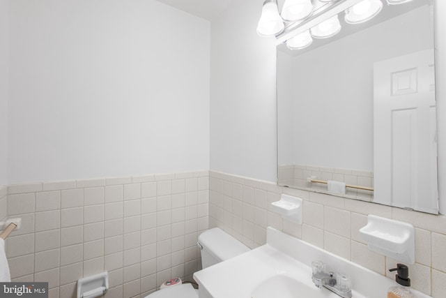 8007 Lewinsville Rd, Mclean, VA 22102 - half bathroom with tile walls, toilet, wainscoting, and vanity